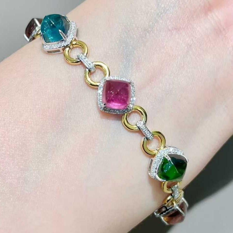 14k Gold 15 Ct Natural Tourmaline & Diamond Bracelet: Ref:231099014 // gold content:14k gold // main gemstone:tourmaline // shape:sugar-loaf // carat weight:15ct // color:color // treatment:natural // // adjacent gemstone 2 : diamond // shape:round //