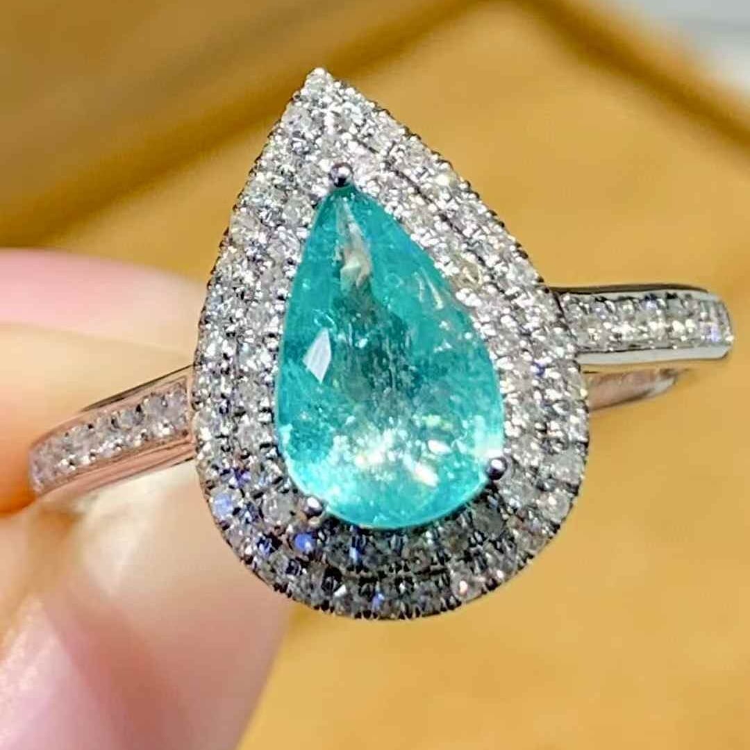 14k Gold 0.8 Ct Natural Paraiba Tourmaline & Diamond Ring: Ref:231099135 // gold content:14k gold // ring size:7. 25us // // main gemstone:paraiba tourmaline // shape:pear // carat weight:0. 8ct // color:blue // treatment:natural // // adjacent gemstone 2 :