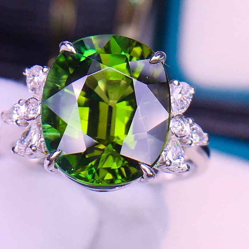 14k Gold 6.3 Ct Natural Tourmaline & Diamond Ring: Ref:231100020 // gold content:14k gold // ring size:7. 25us // // main gemstone:tourmaline // shape:oval // carat weight:6. 3ct // color:green // treatment:natural // // adjacent gemstone 2 : diamond