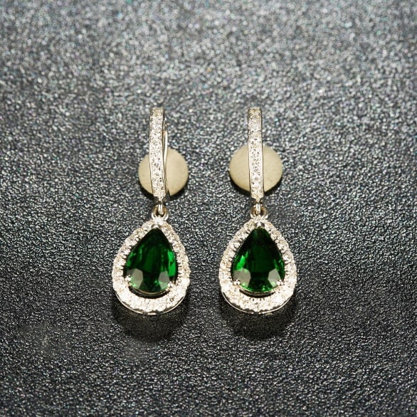 14k Gold 2.20 Ctw Natural Tourmaline & Diamond Earrings: Ref:231100273 // gold content:14k gold // main gemstone:tourmaline // shape:pear // carat weight:1. 68ct // color:green // treatment:natural // // adjacent gemstone 2 : diamond // shape:round //