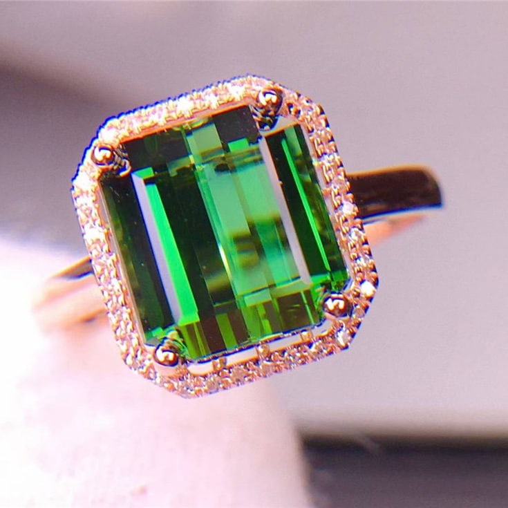 14k Gold 5.2 Ct Natural Tourmaline & Diamond Ring: Ref:231101093 // gold content:14k gold // ring size:7. 25us // // main gemstone:tourmaline // shape:octagonal // carat weight:5. 2ct // color:green // treatment:natural // // adjacent gemstone 2 :