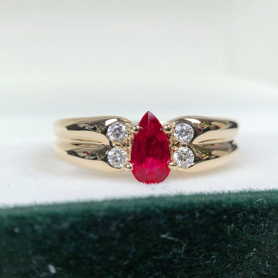14k Gold 0.70 Ctw Vivid Red Natural Ruby & Diamond Ring: Ref:231102203 // gold content:14k gold // ring size:7. 25us // // main gemstone:ruby // shape:pear // carat weight:0. 58ct // color:vivid red // treatment:natural // // adjacent gemstone 2 : diamond