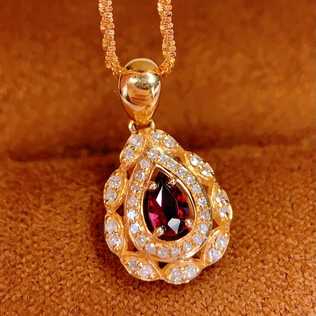 14k Gold 0.3 Ct Natural Ruby & Diamond Pendant( Without Chain ): Ref:231102365 // gold content:14k gold // main gemstone:ruby // shape:pear // carat weight:0. 3ct // color:red // treatment:natural // // adjacent gemstone 2 : diamond // number of stones:39 // shape: