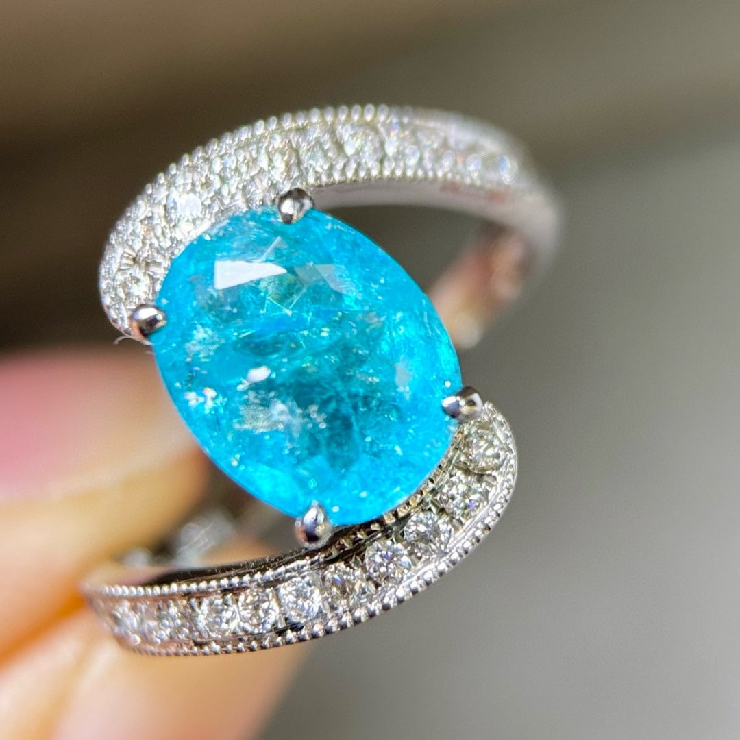 14k Gold 2.40 Ctw Natural Paraiba Tourmaline & Diamond Ring: Ref:231103046 // gold content:14k gold // ring size:7. 25us // // main gemstone:paraiba tourmaline // shape:oval // carat weight:2. 15ct // color:blue // treatment:natural // // adjacent gemstone 2 : 