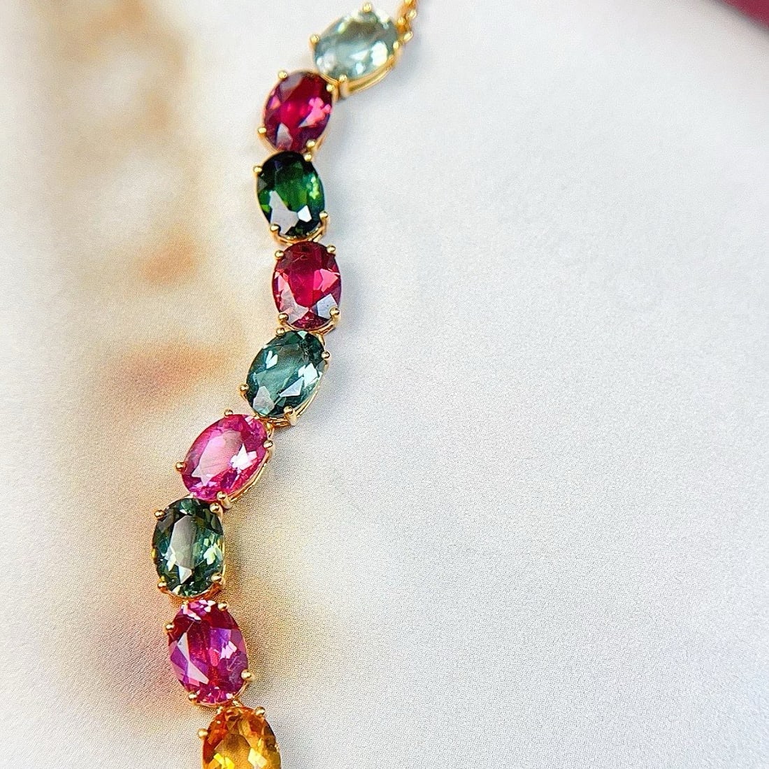 14k Gold 6.8 Ct Natural Tourmaline Bracelet: Ref:231103175 // gold content:14k gold // main gemstone:tourmaline // shape:oval // carat weight:6. 8ct // color:color // treatment:natural // Condition: New Low Estimate: 3100.00 High Estimate: