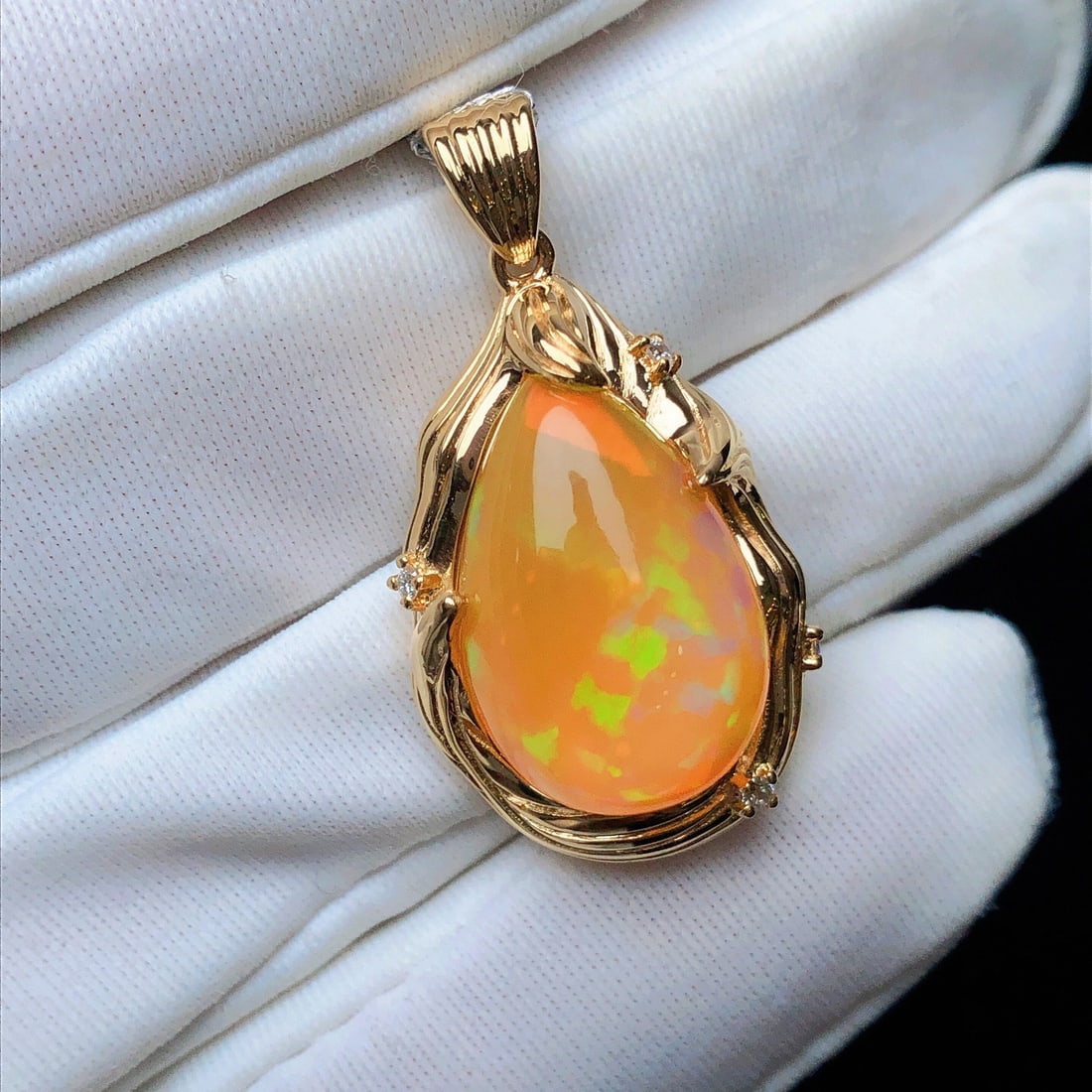 14k Gold 8.22 Ctw Natural Opal & Diamond Pendant( Without Chain ): Ref:231104079 // gold content:14k gold // main gemstone:opal // shape:pear // carat weight:8. 16ct // color:color // treatment:natural // // adjacent gemstone 2 : diamond // shape:round // carat