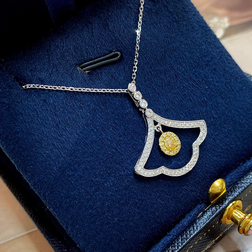 14k Gold 0.48 Ctw Natural Yellow Diamond & Diamond Necklace: Ref:231104085 // gold content:14k gold // main gemstone:yellow diamond // shape:oval // carat weight:0. 15ct // color:yellow // treatment:natural // // adjacent gemstone 2 : diamond // shape:round // 
