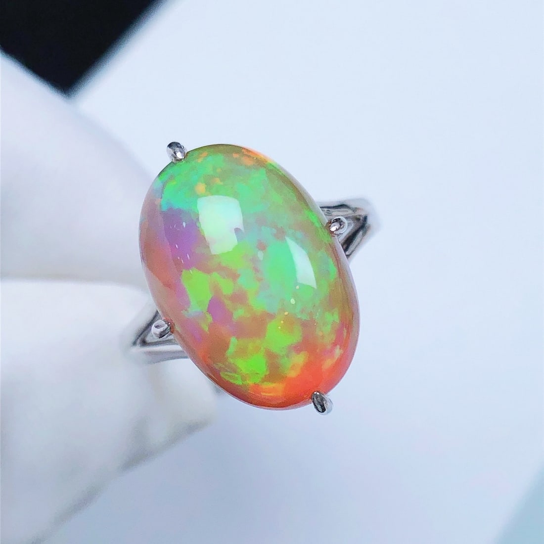 14k Gold 7.21 Ct Natural Opal Ring: Ref:231104114 // gold content:14k gold // ring size:7. 25us // // main gemstone:opal // shape:oval // carat weight:7. 21ct // color:color // treatment:natural // Condition: New Low Estimate: 3500.00