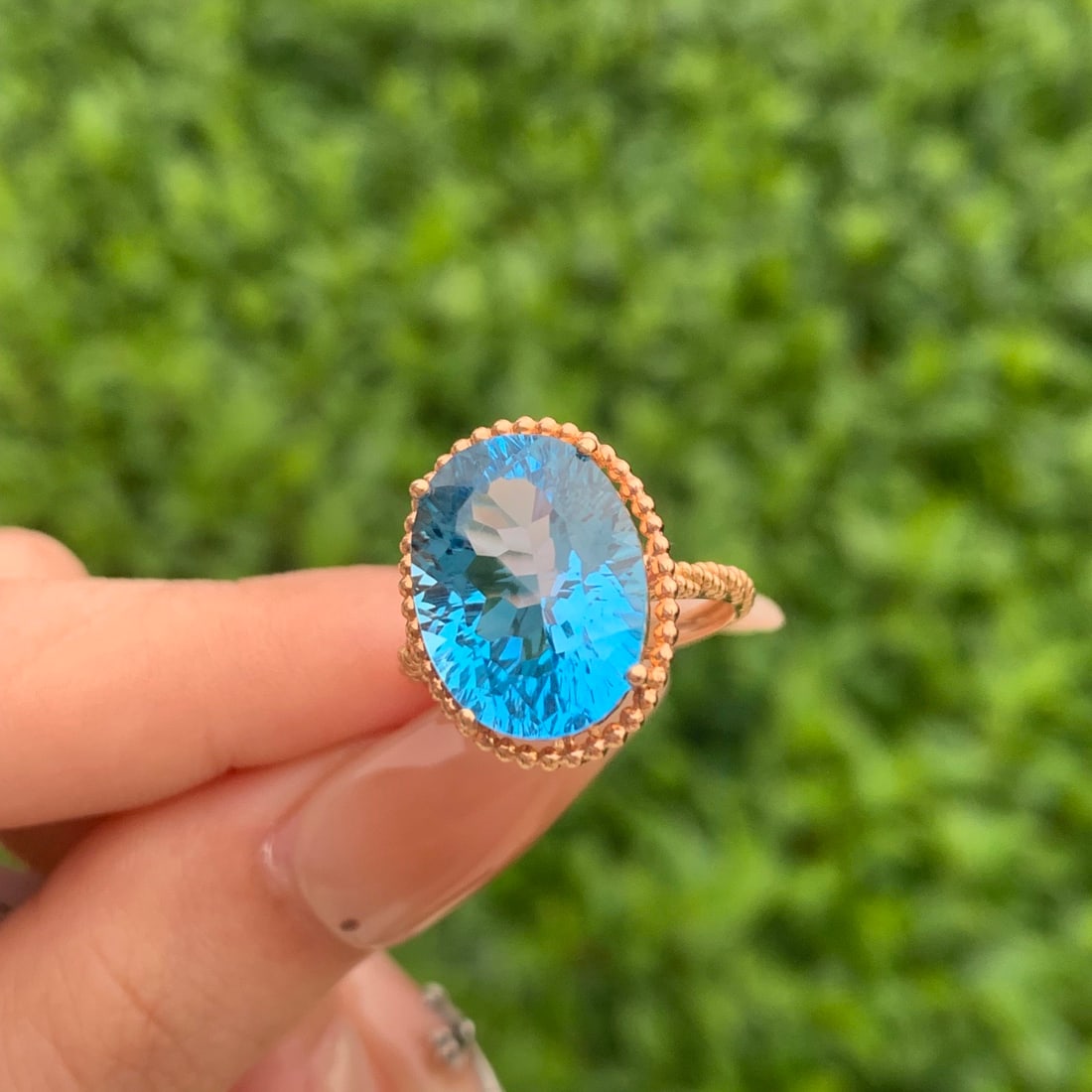 14k Gold 9.20 Ct Natural Topaz Ring: Ref:231104186 // gold content:14k gold // ring size:7. 25us // // main gemstone:topaz // shape:oval // carat weight:9. 20ct // color:blue // treatment:natural // Condition: New Low Estimate: 2100.00