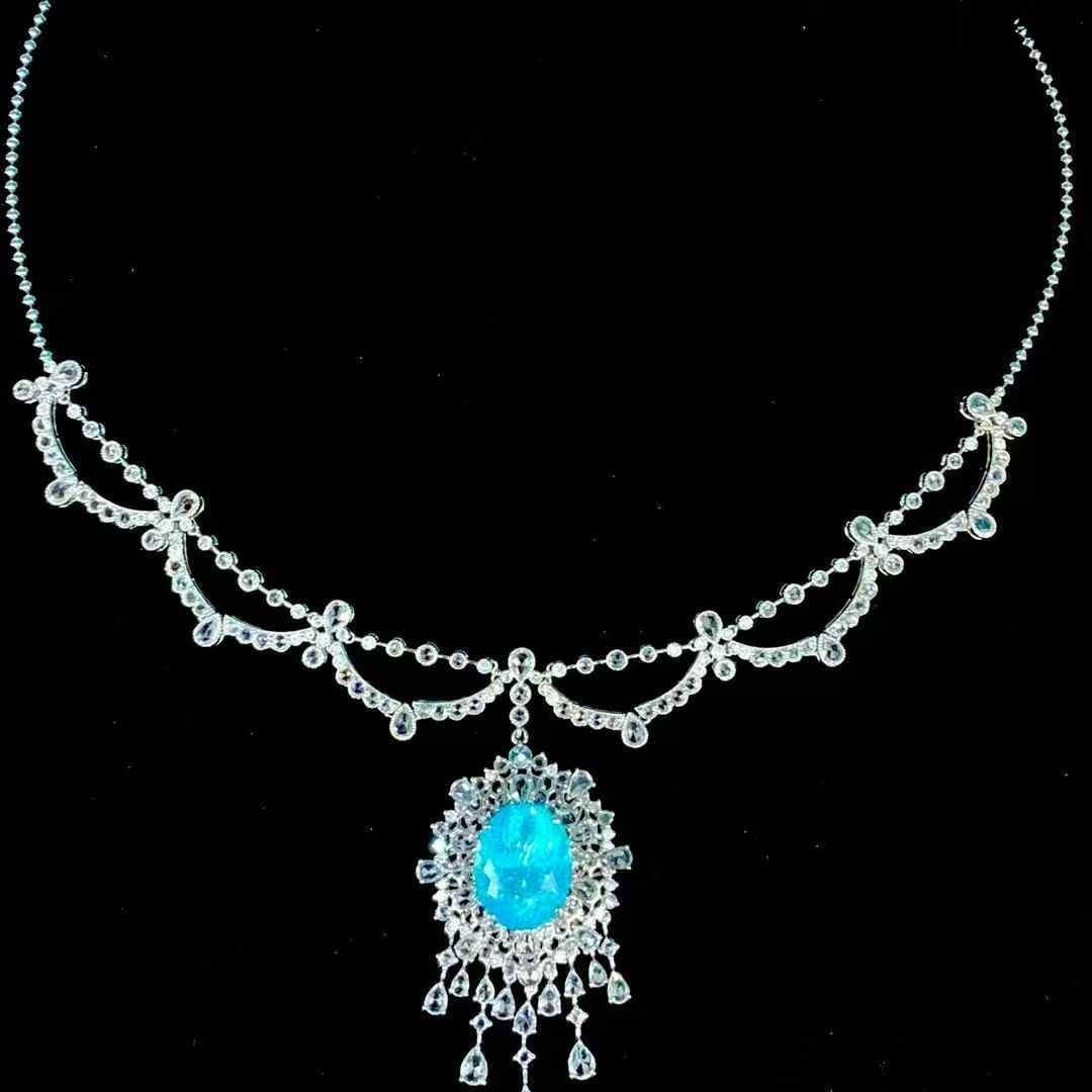 14k Gold 9.25 Ct Natural Paraiba Tourmaline & Diamond Necklace: Ref:231105011 // gold content:14k gold // main gemstone:paraiba tourmaline // shape:oval // carat weight:9. 25ct // color:blue // treatment:natural // // adjacent gemstone 2 : diamond // shape:round