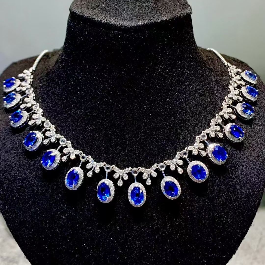 14k Gold 9.3 Ct Vivid Blue Natural Sapphire & Diamond Necklace: Ref:231105024 // gold content:14k gold // main gemstone:sapphire // shape:oval // carat weight:9. 3ct // color:vivid blue // treatment:natural // // adjacent gemstone 2 : diamond // shape:round // cla