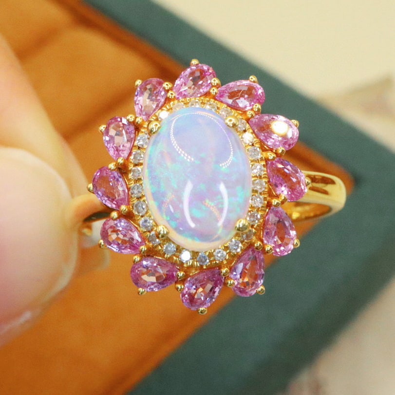 14k Gold 1.47 Ctw Natural Opal & Sapphire Ring: Ref:231105073 // gold content:14k gold // ring size:7. 25us // // main gemstone:opal // shape:oval // carat weight:0. 72ct // color:color // treatment:natural // // adjacent gemstone 2 : sapphire // n
