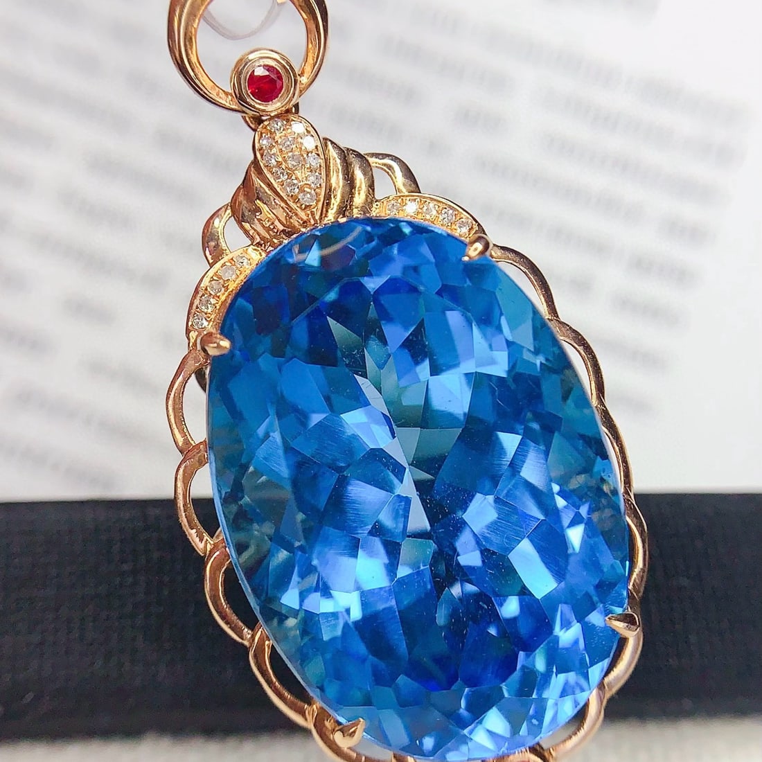 14k Gold 33 Ct Natural Topaz & Diamond Pendant( Without Chain ): Ref:231105087 // gold content:14k gold // main gemstone:topaz // shape:oval // carat weight:33ct // color:blue // treatment:natural // // adjacent gemstone 2 : diamond // number of stones:22 //