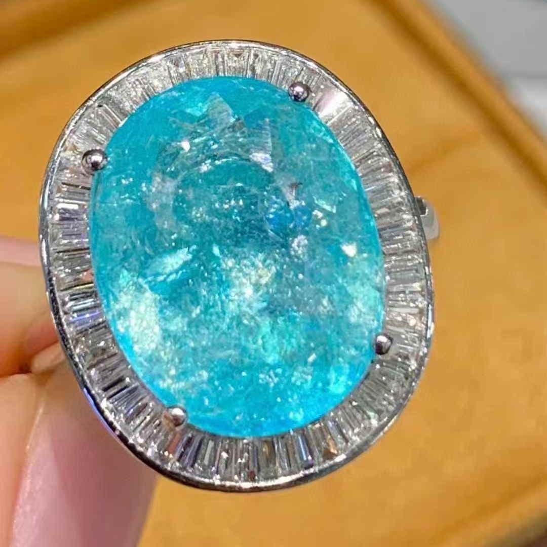 14k Gold 6.6 Ct Natural Paraiba Tourmaline & Diamond Ring: Ref:231105091 // gold content:14k gold // ring size:7. 25us // // main gemstone:paraiba tourmaline // shape:oval // carat weight:6. 6ct // color:blue // treatment:natural // // adjacent gemstone 2 :
