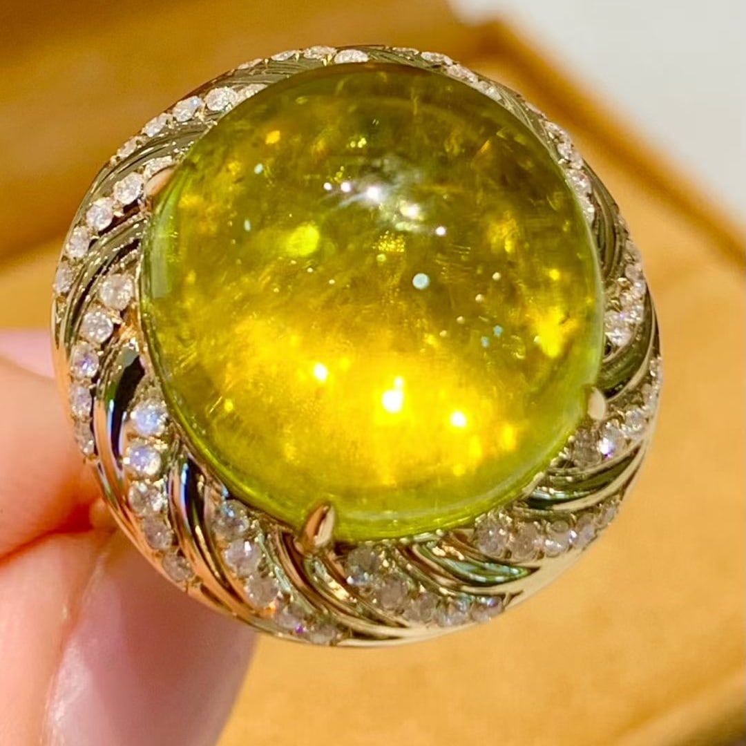 14k Gold 15.6 Ct Natural Tourmaline & Diamond Ring: Ref:231105132 // gold content:14k gold // ring size:7. 25us // // main gemstone:tourmaline // shape:round // carat weight:15. 6ct // color:yellow // treatment:natural // // adjacent gemstone 2 : diamo