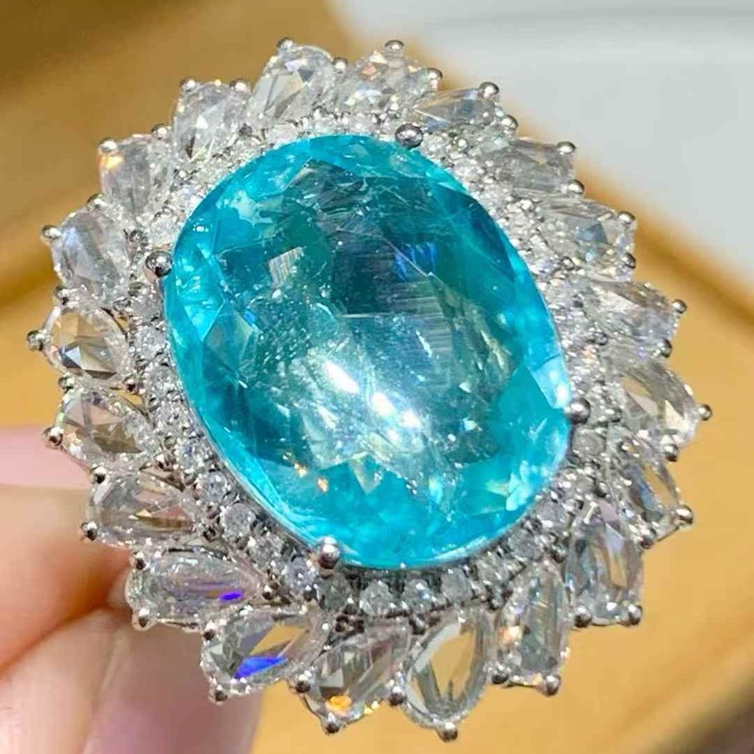 14k Gold 7.12 Ct Natural Paraiba Tourmaline & Diamond Ring: Ref:231105133 // gold content:14k gold // ring size:7. 25us // // main gemstone:paraiba tourmaline // shape:oval // carat weight:7. 12ct // color:blue // treatment:natural // // adjacent gemstone 2 : 