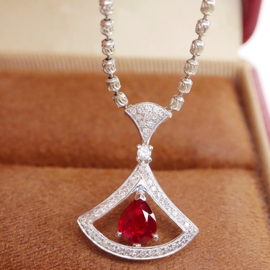 14k Gold 0.62 Ctw Natural Ruby & Diamond Pendant( Without Chain ): Ref:231105151 // gold content:14k gold // main gemstone:ruby // shape:pear // carat weight:0. 48ct // color:red // treatment:natural // // adjacent gemstone 2 : diamond // shape:round // carat weight: