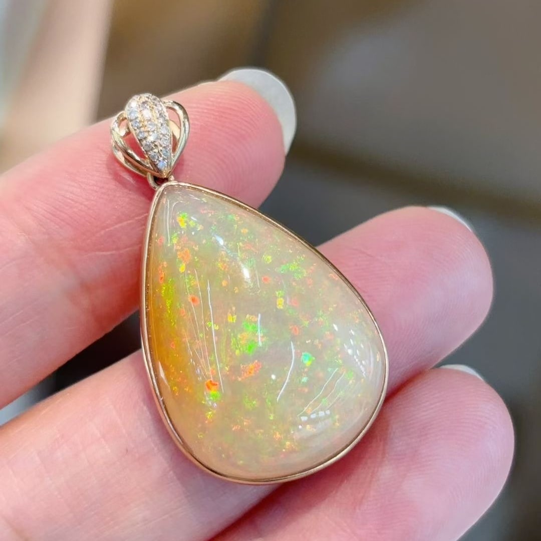 14k Gold 12.06 Ctw Natural Opal & Diamond Pendant( Without Chain ): Ref:231105204 // gold content:14k gold // main gemstone:opal // shape:pear // carat weight:12. 00ct // color:color // treatment:natural // // adjacent gemstone 2 : diamond // shape:round // carat