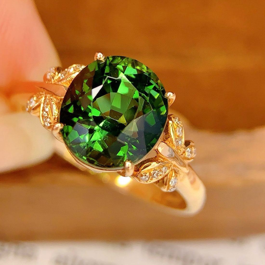 14k Gold 3.18 Ct Natural Tourmaline & Diamond Ring: Ref:231105216 // gold content:14k gold // ring size:7. 25us // // main gemstone:tourmaline // shape:oval // carat weight:3. 18ct // color:green // treatment:natural // // adjacent gemstone 2 : diamond