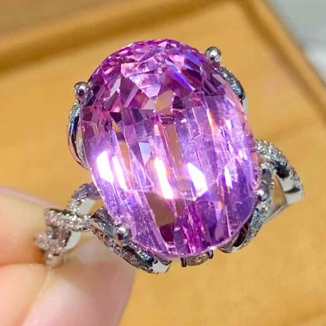14k Gold 11.5 Ct Natural Kunzite & Diamond Ring: Ref:231105247 // gold content:14k gold // ring size:7. 25us // // main gemstone:kunzite // shape:oval // carat weight:11. 5ct // color:pinkish purple // treatment:natural // // adjacent gemstone 2 :