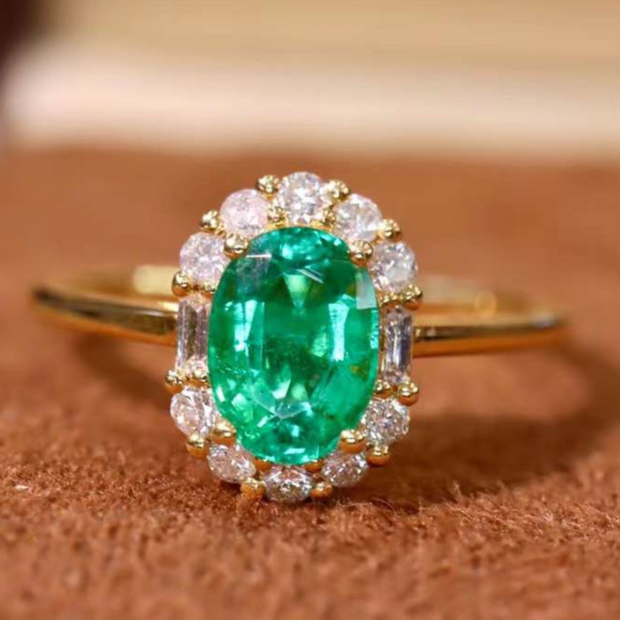 14k Gold 0.96 Ctw Vivid Green Natural Emerald & Diamond Ring: Ref:231106038 // gold content:14k gold // ring size:7. 25us // // main gemstone:emerald // shape:oval // carat weight:0. 76ct // color:vivid green // treatment:natural // // adjacent gemstone 2 :