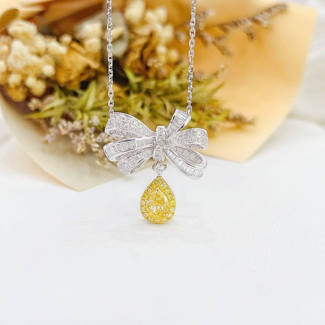 14k Gold 1.53 Ctw Natural Yellow Diamond & Diamond Necklace: Ref:231106050 // gold content:14k gold // main gemstone:yellow diamond // shape:pear // carat weight:0. 60ct // color:yellow // treatment:natural // // adjacent gemstone 2 : diamond // shape:multiple