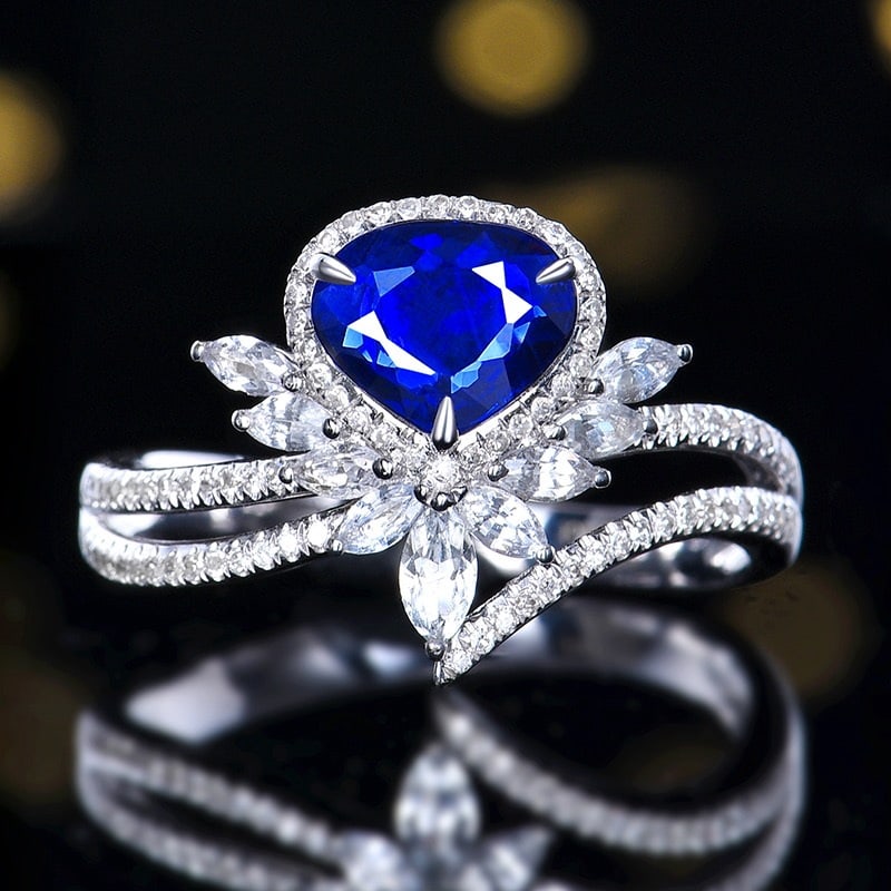 14k Gold 1.14 Ctw Natural Sapphire & Diamond Ring: Ref:231106113 // gold content:14k gold // ring size:7. 25us // // main gemstone:sapphire // shape:pear // carat weight:0. 94ct // color:royal blue // treatment:natural // // adjacent gemstone 2 : diam