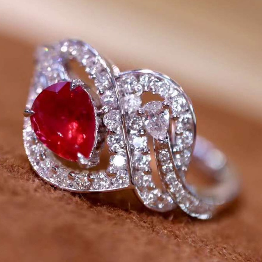 14k Gold 1.17 Ctw Natural Ruby & Diamond Ring: Ref:231106119 // gold content:14k gold // ring size:7. 25us // // main gemstone:ruby // shape:pear // carat weight:0. 73ct // color:pigeonblood red // treatment:natural // // adjacent gemstone 2 :