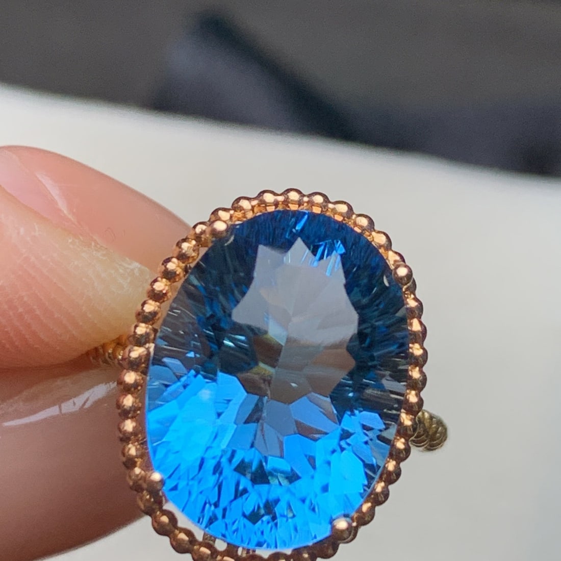 14k Gold 9.20 Ct Natural Topaz Ring: Ref:231106121 // gold content:14k gold // ring size:7. 25us // // main gemstone:topaz // shape:oval // carat weight:9. 20ct // color:blue // treatment:natural // Condition: New Low Estimate: 2200.00
