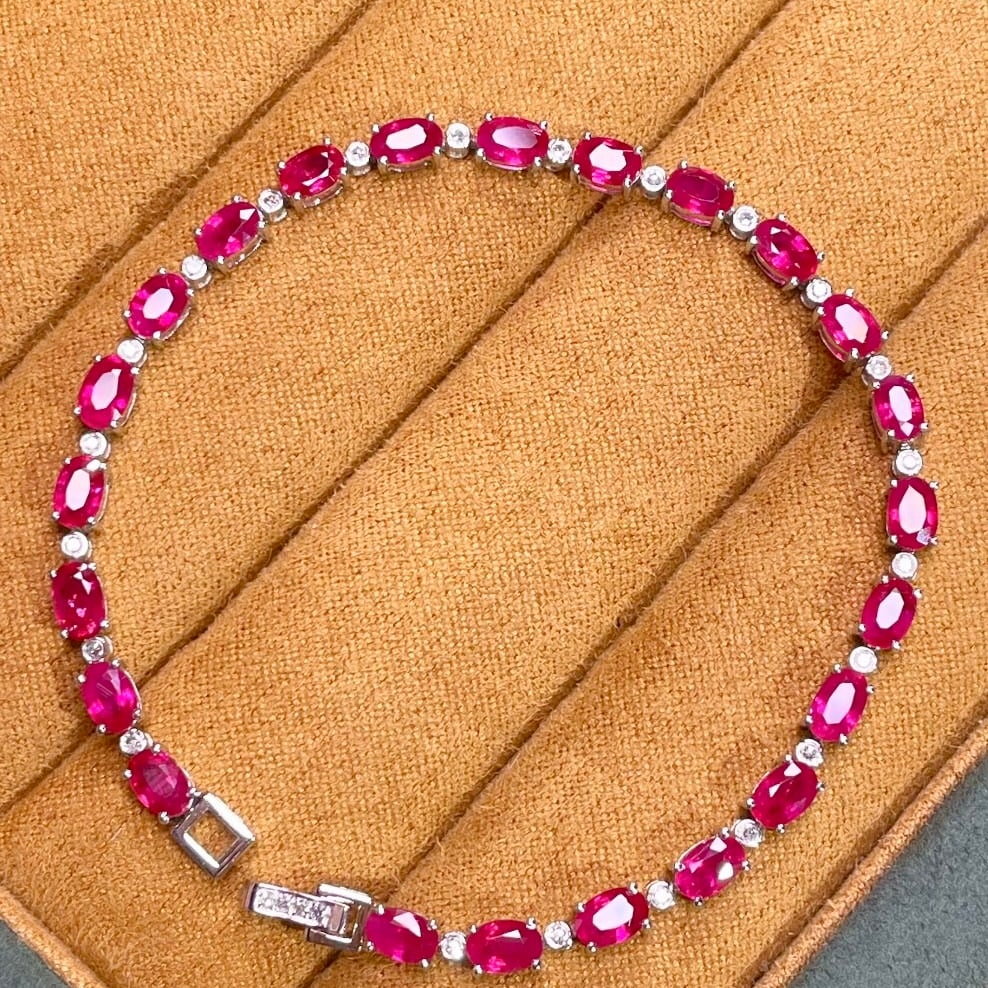 14k Gold 7.5 Ct Natural Ruby & Diamond Bracelet: Ref:231106178 // gold content:14k gold // main gemstone:ruby // shape:oval // carat weight:7. 5ct // color:red // treatment:natural // // adjacent gemstone 2 : diamond // number of stones:26 //