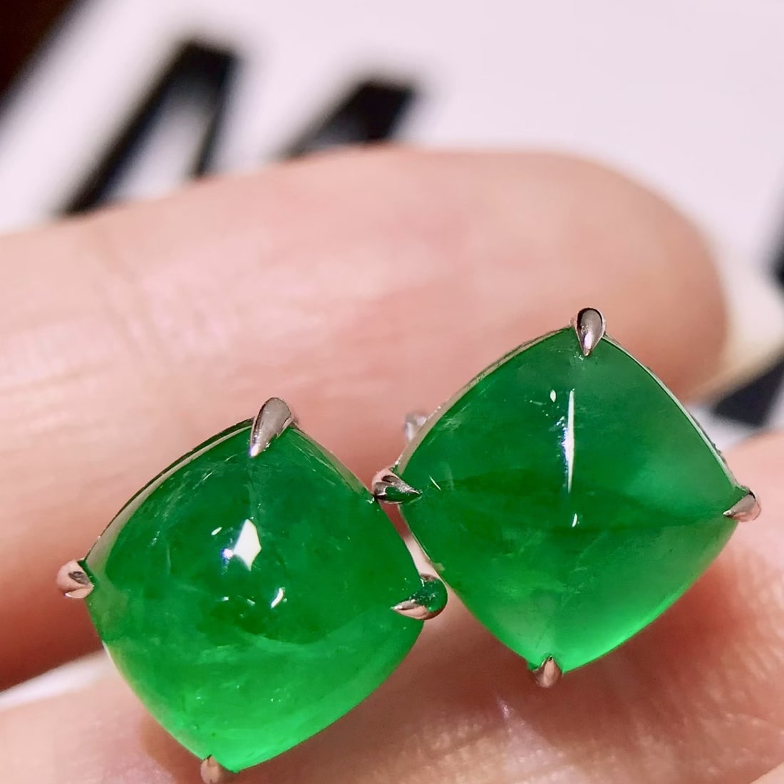 14k Gold 6.2 Ct Vivid Green Natural Emerald Earrings: Ref:231106199 // gold content:14k gold // main gemstone:emerald // shape:sugar-loaf // carat weight:6. 2ct // color:vivid green // treatment:natural // Condition: New Low Estimate: 5700.00 High