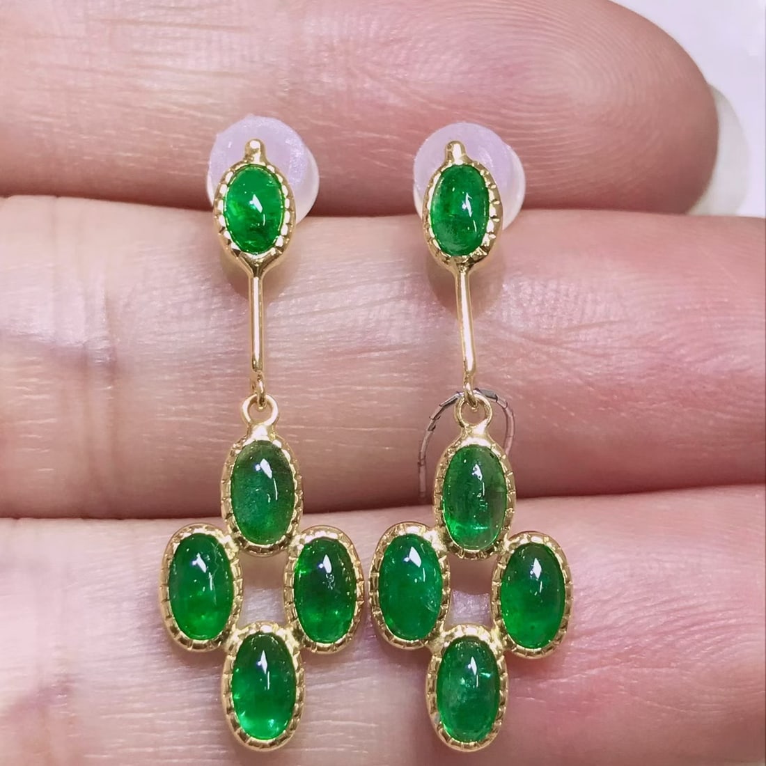 14k Gold 2.61 Ct Natural Emerald Earrings: Ref:231106222 // gold content:14k gold // main gemstone:emerald // shape:oval // carat weight:2. 61ct // color:green // treatment:natural // Condition: New Low Estimate: 2600.00 High Estimate: 4000.00