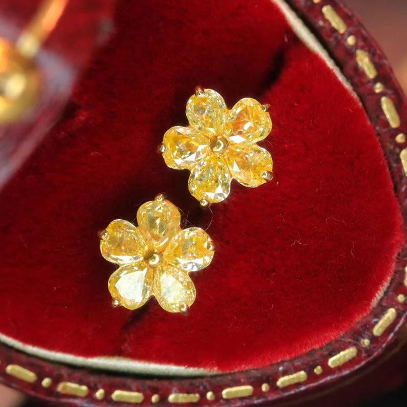 14k Gold 0.8 Ct Natural Yellow Diamond Earrings: Ref:231106275 // gold content:14k gold // main gemstone:yellow diamond // shape:pear // carat weight:0. 8ct // color:yellow // treatment:natural // Condition: New Low Estimate: 2600.00 High Estimate: