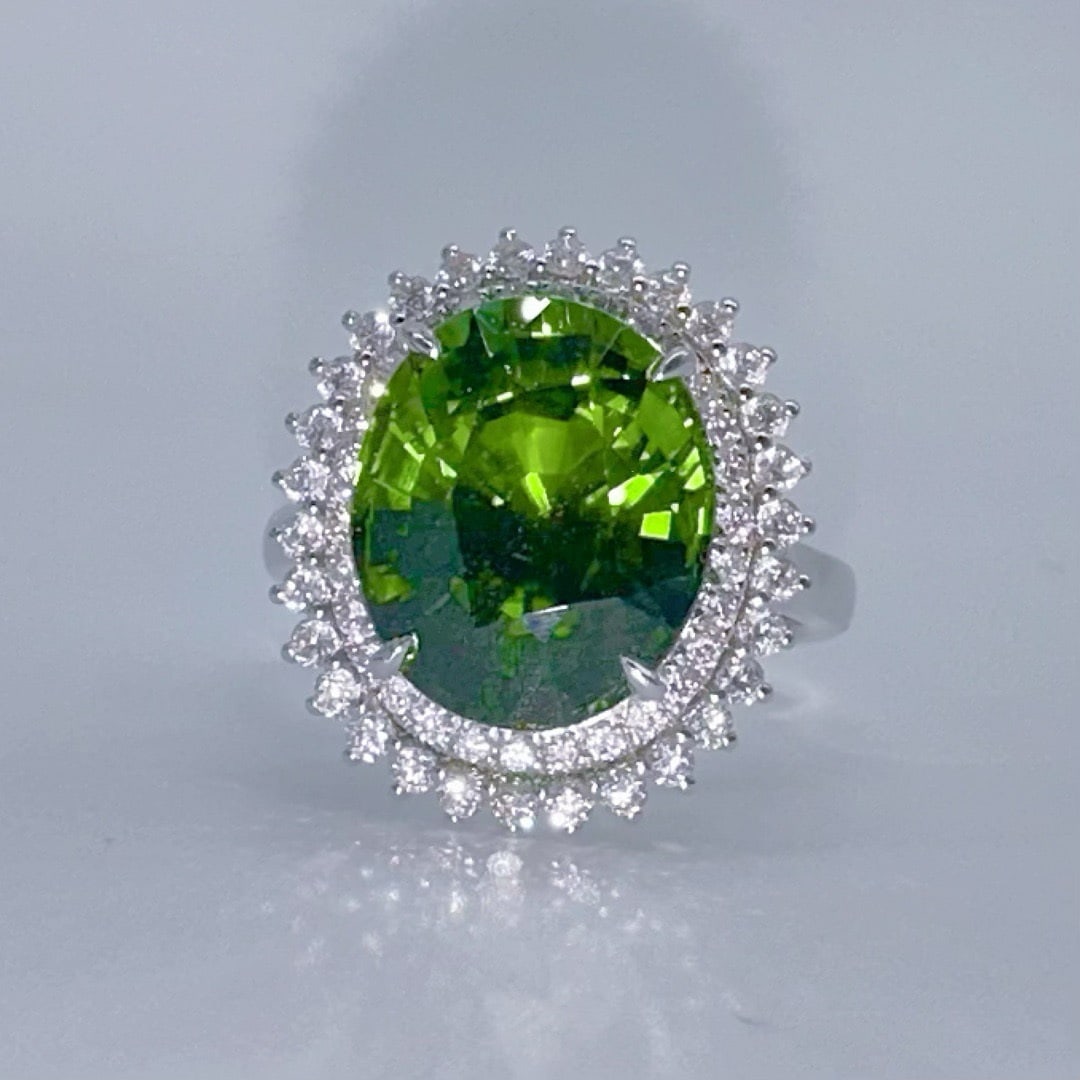 14k Gold 7.67 Ctw Natural Tourmaline & Diamond Ring: Ref:231106290 // gold content:14k gold // ring size:7. 25us // // main gemstone:tourmaline // shape:oval // carat weight:7. 01ct // color:green // treatment:natural // // adjacent gemstone 2 : diamond