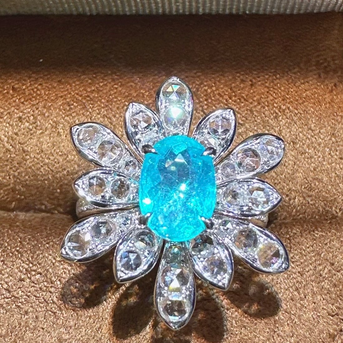 14k Gold 2.31 Ctw Natural Paraiba Tourmaline & Diamond Ring: Ref:231106293 // gold content:14k gold // ring size:7. 25us // // main gemstone:paraiba tourmaline // shape:oval // carat weight:1. 47ct // color:blue // treatment:natural // // adjacent gemstone 2 :
