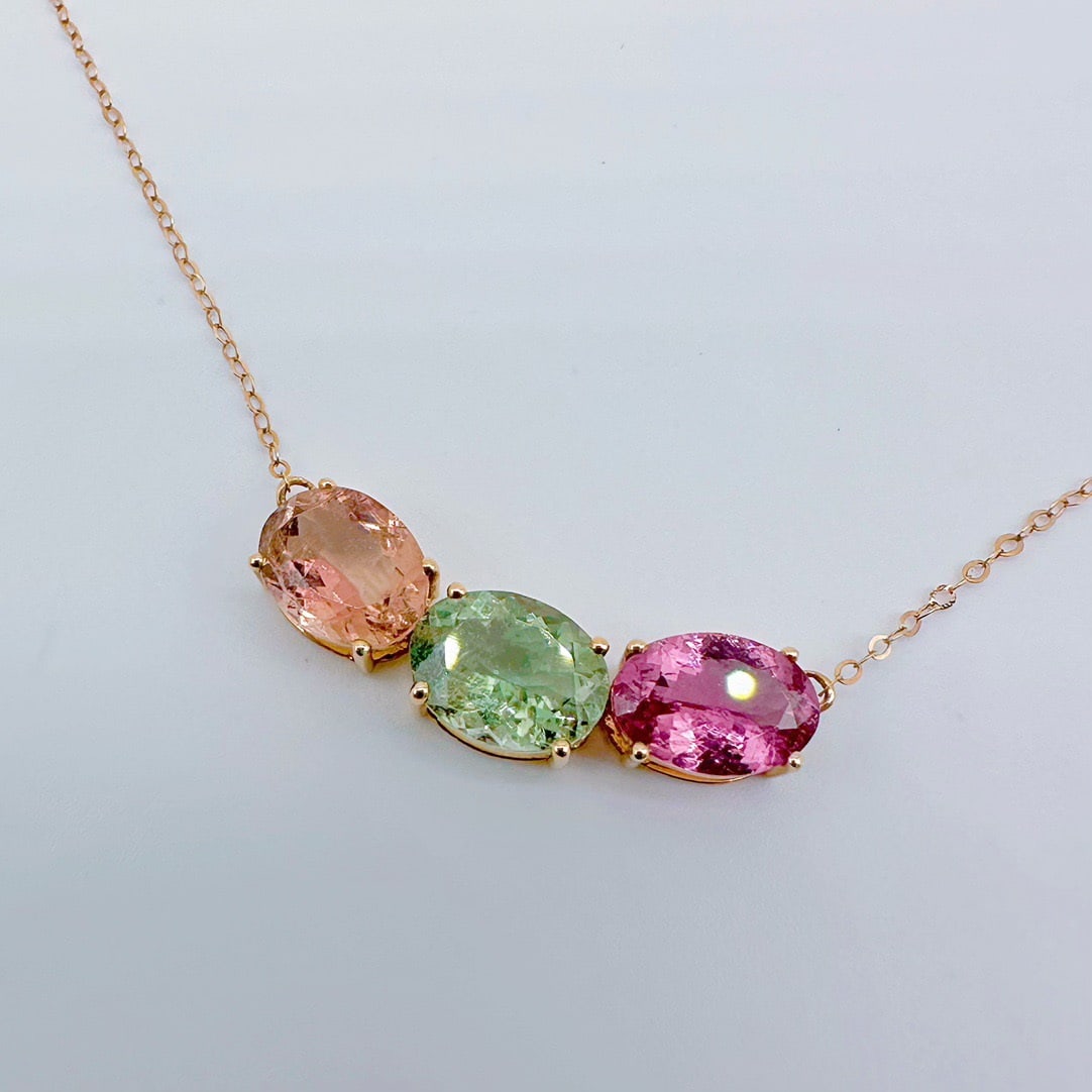 14k Gold 6.10 Ct Natural Tourmaline Necklace: Ref:231106349 // gold content:14k gold // main gemstone:tourmaline // shape:oval // carat weight:6. 10ct // color:color // treatment:natural // Condition: New Low Estimate: 2600.00 High Estimate: