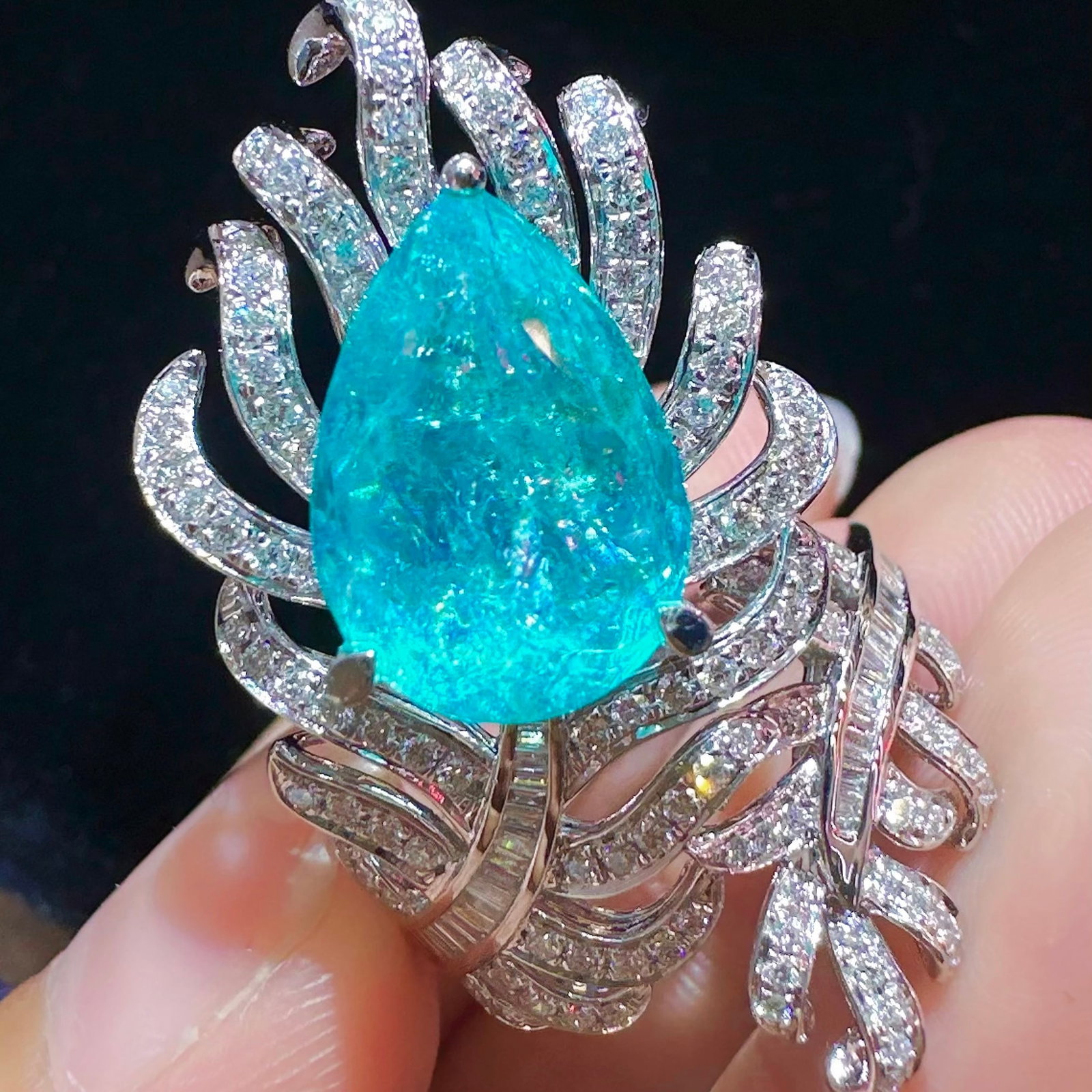 14k Gold 6.43 Ctw Natural Paraiba Tourmaline & Diamond Ring: Ref:231106432 // gold content:14k gold // ring size:7. 25us // // main gemstone:paraiba tourmaline // shape:pear // carat weight:5. 66ct // color:blue // treatment:natural // // adjacent gemstone 2 : 