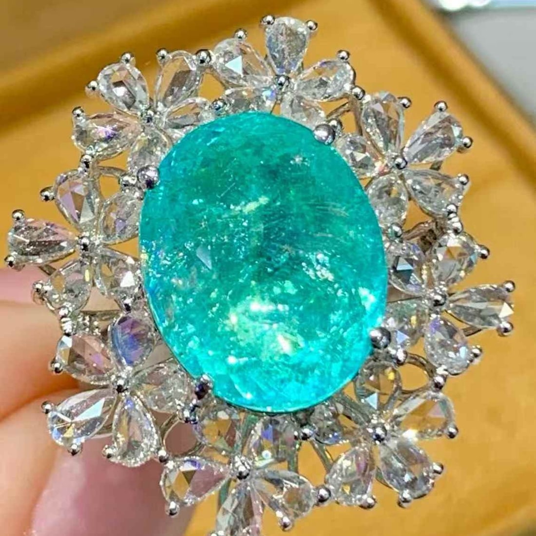 14k Gold 6.68 Ct Natural Paraiba Tourmaline & Diamond Ring: Ref:231107011 // gold content:14k gold // ring size:7. 25us // // main gemstone:paraiba tourmaline // shape:oval // carat weight:6. 68ct // color:blue // treatment:natural // // adjacent gemstone 2 :