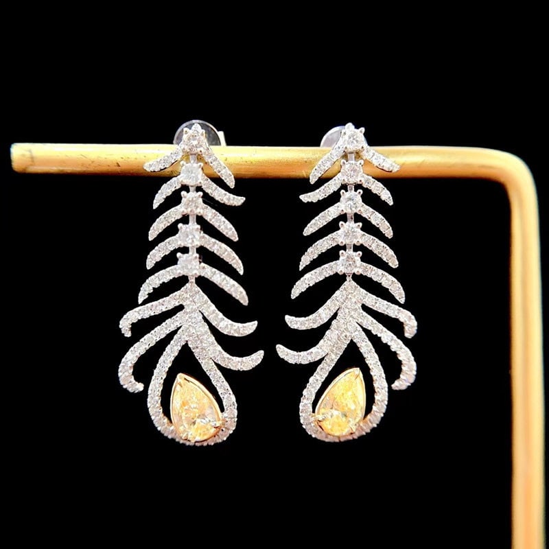 14k Gold 1.6 Ctw Natural Yellow Diamond & Diamond Earrings: Ref:231107041 // gold content:14k gold // main gemstone:yellow diamond // shape:pear // carat weight:0. 6ct // color:yellow // treatment:natural // // adjacent gemstone 2 : diamond // shape:round //