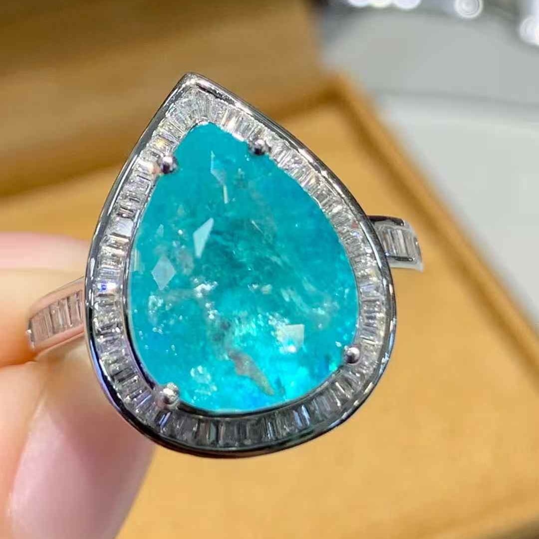 14k Gold 7.3 Ct Natural Paraiba Tourmaline & Diamond Ring: Ref:231107132 // gold content:14k gold // ring size:7. 25us // // main gemstone:paraiba tourmaline // shape:pear // carat weight:7. 3ct // color:blue // treatment:natural // // adjacent gemstone 2 :