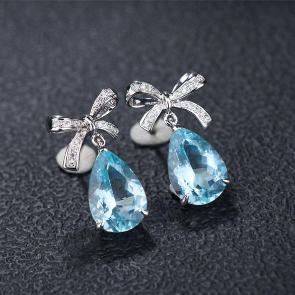 14k Gold 3.58 Ct Natural Aquamarine & Diamond Earrings: Ref:231107133 // gold content:14k gold // main gemstone:aquamarine // shape:pear // carat weight:3. 58ct // color:santa maria color // treatment:natural // // adjacent gemstone 2 : diamond //