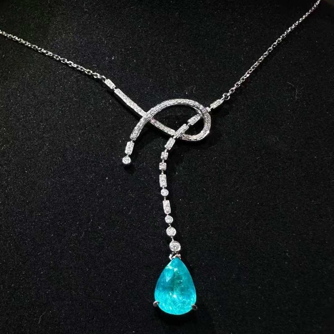 14k Gold 1.61 Ctw Natural Paraiba Tourmaline & Diamond Necklace: Ref:231107171 // gold content:14k gold // main gemstone:paraiba tourmaline // shape:pear // carat weight:1. 40ct // color:blue // treatment:natural // // adjacent gemstone 2 : diamond // shape:round