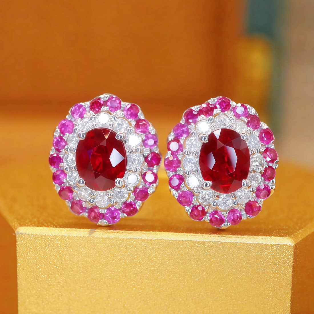 14k Gold 0.91 Ctw Natural Ruby & Ruby Earrings: Ref:231107191 // gold content:14k gold // main gemstone:ruby // shape:oval // carat weight:0. 6ct // color:pigeonblood red // treatment:natural // // adjacent gemstone 2 : ruby // shape:round //