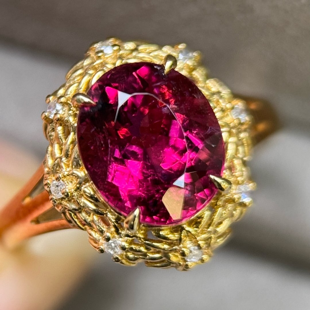 14k Gold 3.47 Ctw Natural Tourmaline & Diamond Ring: Ref:231107220 // gold content:14k gold // ring size:7. 25us // // main gemstone:tourmaline // shape:oval // carat weight:3. 41ct // color:red // treatment:natural // // adjacent gemstone 2 : diamond