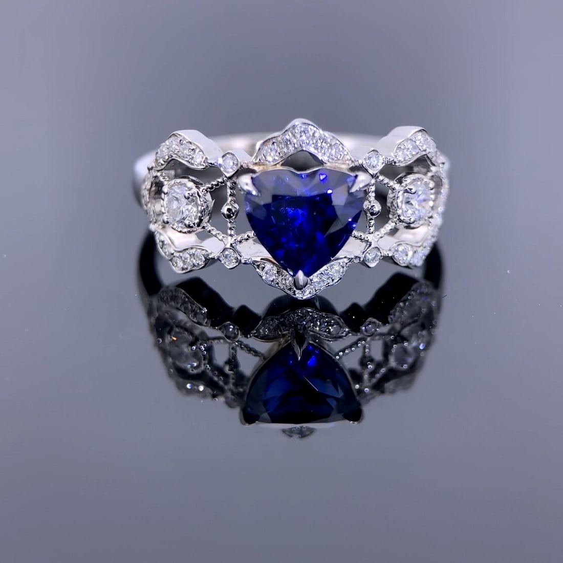 14k Gold 1.61 Ctw Natural Sapphire & Diamond Ring: Ref:231108010 // gold content:14k gold // ring size:7. 25us // // main gemstone:sapphire // shape:heart // carat weight:1. 33ct // color:blue // treatment:natural // // adjacent gemstone 2 : diamond