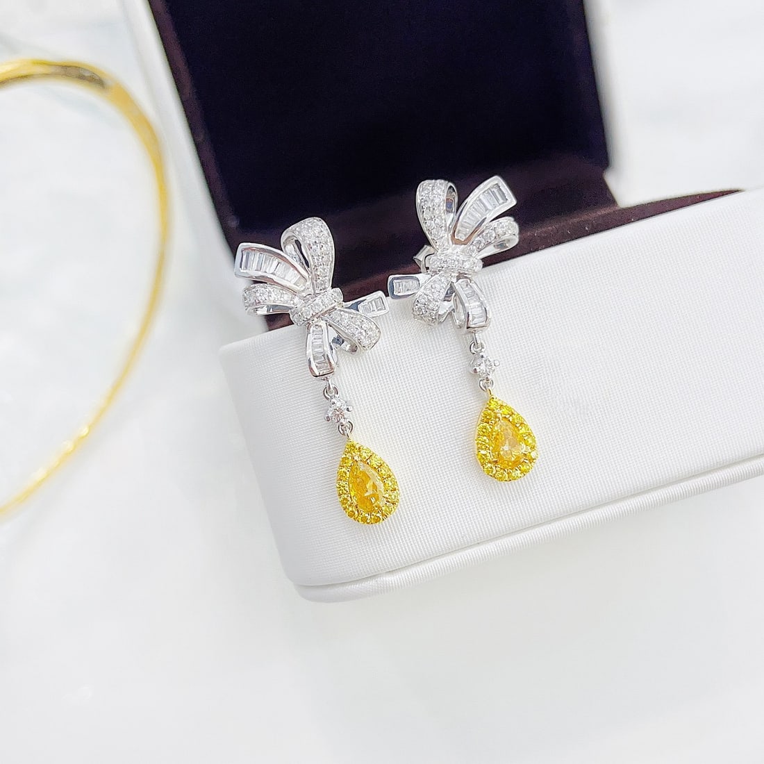14k Gold 1.16 Ctw Natural Yellow Diamond & Diamond Earrings: Ref:231108020 // gold content:14k gold // main gemstone:yellow diamond // shape:pear // carat weight:0. 44ct // color:yellow // treatment:natural // // adjacent gemstone 2 : diamond // shape:multiple 
