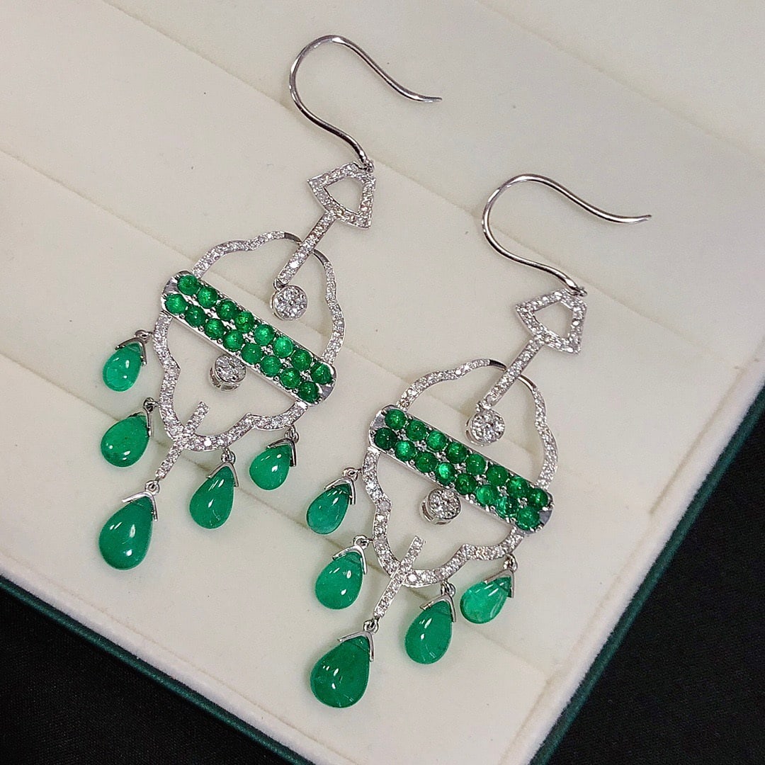 14k Gold 14.17 Ctw Natural Emerald & Diamond Earrings: Ref:231108047 // gold content:14k gold // main gemstone:emerald // shape:pear // carat weight:12. 97ct // color:green // treatment:natural // // adjacent gemstone 2 : diamond // shape:round // carat