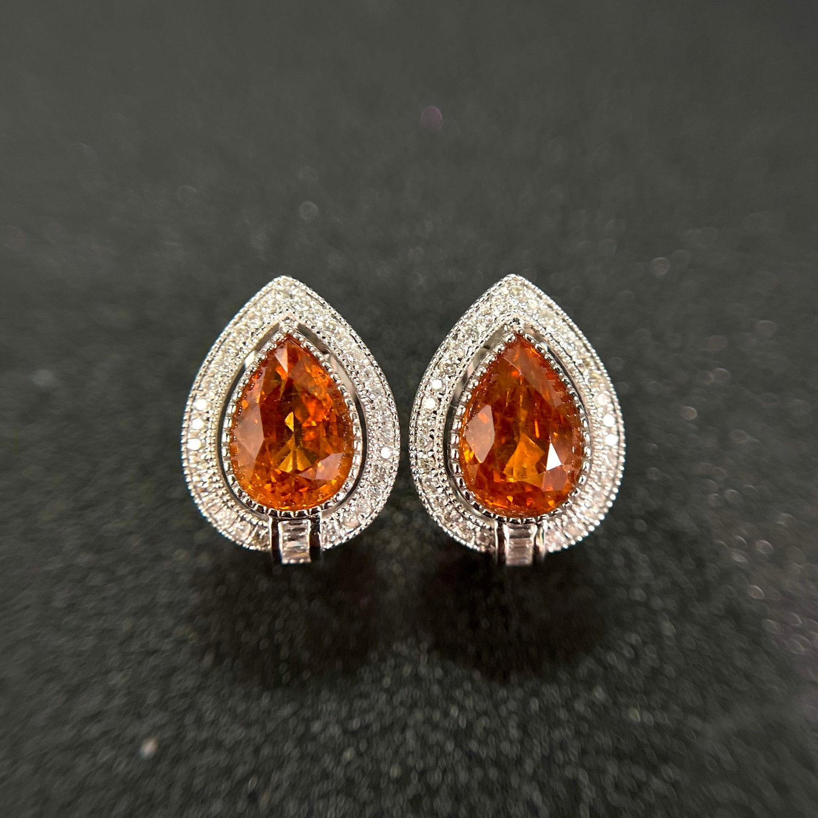 14k Gold 2.33 Ctw Natural Spessartine & Diamond Earrings: Ref:231108145 // gold content:14k gold // main gemstone:spessartine // shape:pear // carat weight:1. 95ct // color:orange // treatment:natural // // adjacent gemstone 2 : diamond // shape:multiple //