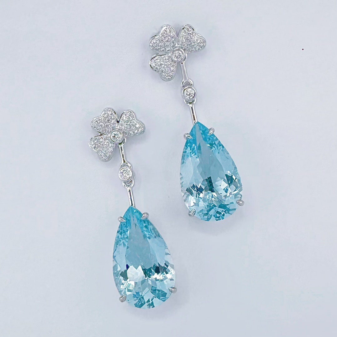 14k Gold 11.00 Ctw Natural Aquamarine & Diamond Earrings: Ref:231108250 // gold content:14k gold // main gemstone:aquamarine // shape:pear // carat weight:10. 65ct // color:santa maria color // treatment:natural // // adjacent gemstone 2 : diamond // shape:r