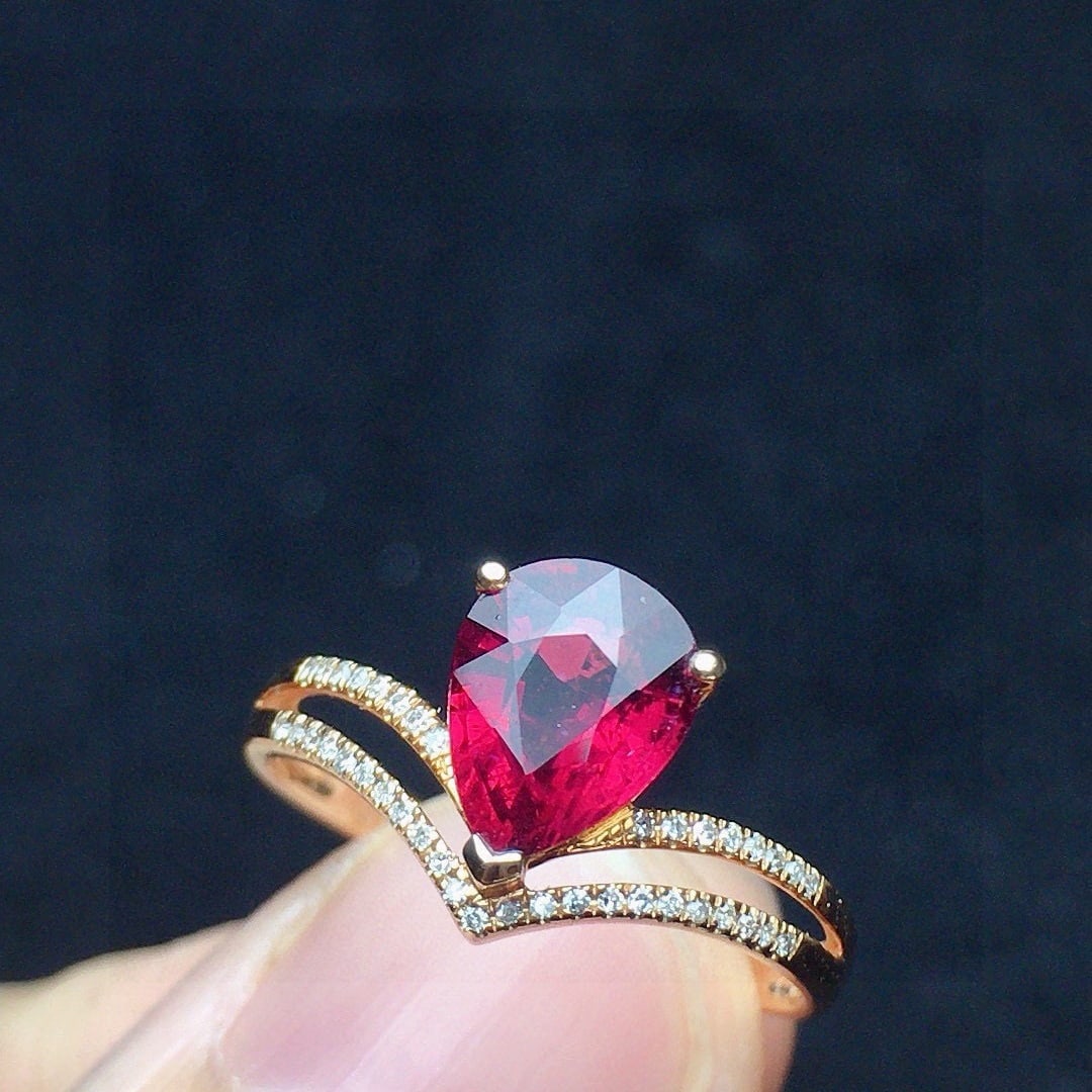 14k Gold 1.23 Ct Natural Tourmaline & Diamond Ring: Ref:231108391 // gold content:14k gold // ring size:7. 25us // // main gemstone:tourmaline // shape:pear // carat weight:1. 23ct // color:red // treatment:natural // // adjacent gemstone 2 : diamond
